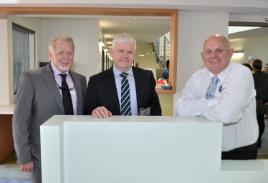 PhotoID:12813, Deputy VC Prof Graham Pegg (left) and VC Professor Scott Bowman (right) welcome Health Workforce Australia CEO Mark Cormack to the new building