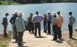 PhotoID:10766, Learning about blue-green algae by the dam.