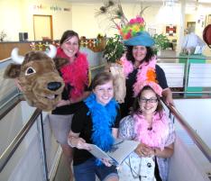 PhotoID:12252, Chiquita Dielwart (blue hat) gets into the storybook spirit of Romp in the Park with other students Melissa Bailey (bull), Breanna Sawtell (book) and Sarah Nevell (horse) 