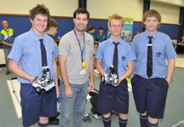 PhotoID:10986, Visiting robotics specialist Dr Damien Kee with students from Mackay Christian College