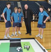 PhotoID:12784, Mercy College (Mackay) students explain their robots to Vice-Chancellor Professor Scott Bowman.