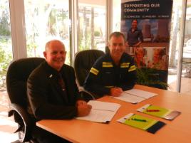 PhotoID:13676, CQUniversity Vice-Chancellor Professor Scott Bowman and Rio Tinto's Hail Creek Mine General Manager Operations Rowan Munro sign the MoU. 