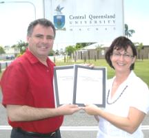 PhotoID:5510, Robyn Smith presents MP James Bidgood with a course information pack