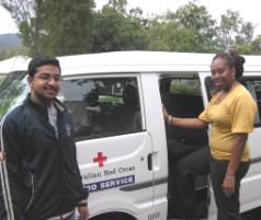 PhotoID:4737, Student Niraj Sharma and staff member Reegan Bickey with the blood bus