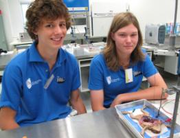 PhotoID:8252, Mt Morgan students Jonathon Stock and Casey Lennox enjoy the hands-on experiments at CQUniversity.