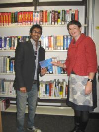 PhotoID:11038, Rehan receives his voucher prize for winning the campus writing competition