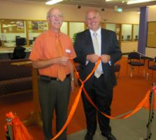 PhotoID:9747, Graham wears an orange shirt in homage to the library carpet which will be removed as part of the refurbishment. He is pictured here with Vice-Chancellor Scott Bowman at the refurbishment launch.